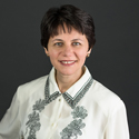 LinkedIn icon and link to Oksana Tchoutchman's profile.